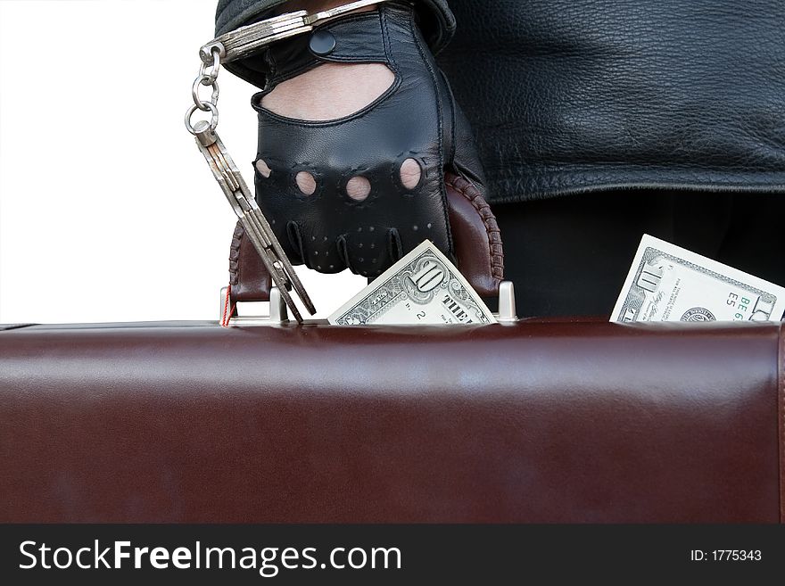 Case with ten dollars bills, fastened by handcuffs to a hand