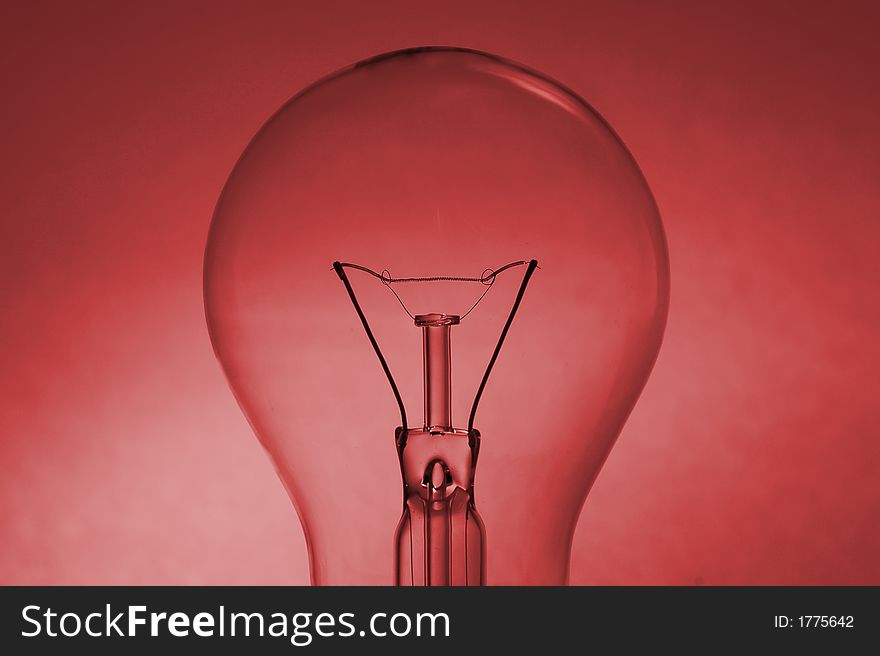 Light bulb silhouette over a coloured red background