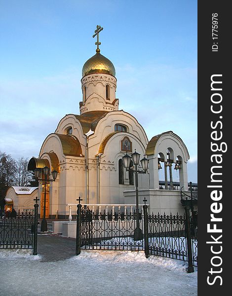 Small Christian church in the winter, on a decline on a background of the sky. Small Christian church in the winter, on a decline on a background of the sky.