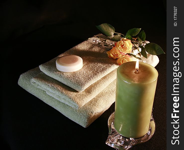 Towels, candles, flame, roses, soap, all ready for a romantic evening. Towels, candles, flame, roses, soap, all ready for a romantic evening