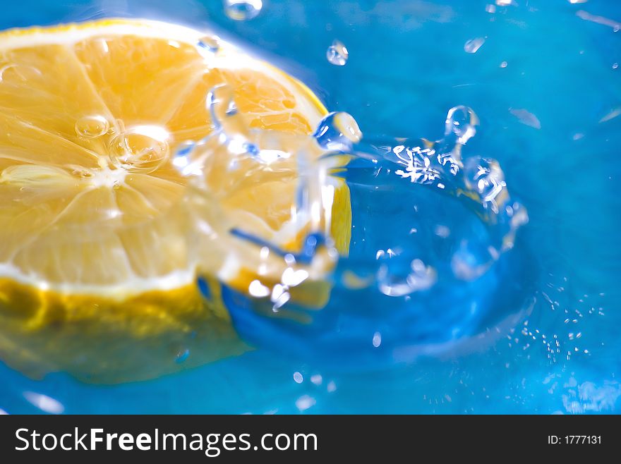 Lemon fruit on the water with blue background. Lemon fruit on the water with blue background