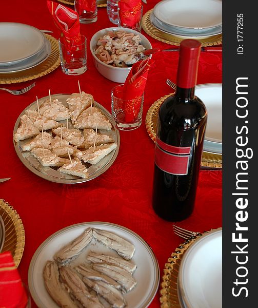 Christmas table with red wine and meals. Christmas table with red wine and meals