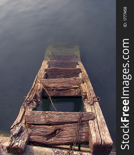 Old broken stairs to the water. Old broken stairs to the water