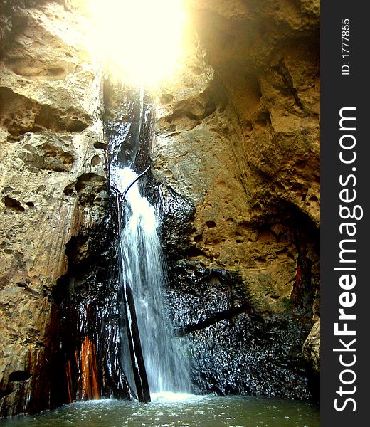 Sunburst Over Waterfall