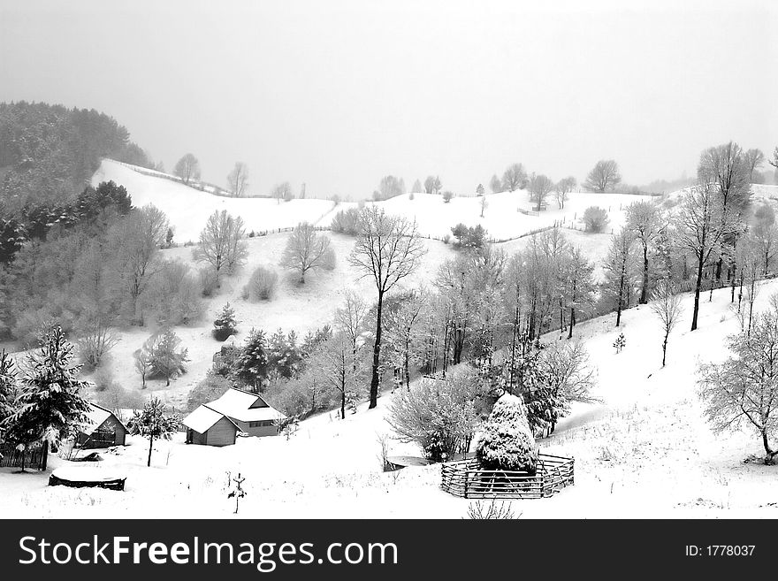 Black and white village under snow. Black and white village under snow