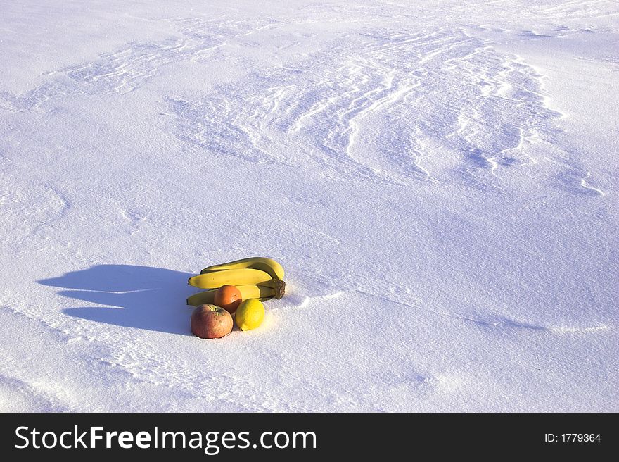Fruits on the snowdrift with shadow. Fruits on the snowdrift with shadow