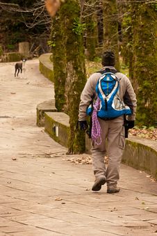 Hiker Walking In A Man Made Trail Royalty Free Stock Photos