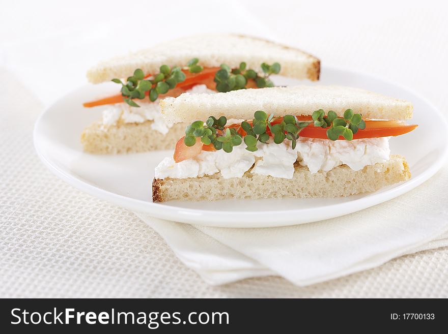 Vegetarian sandwiches with cottage cheese, tomatoes and mustard sprouts
