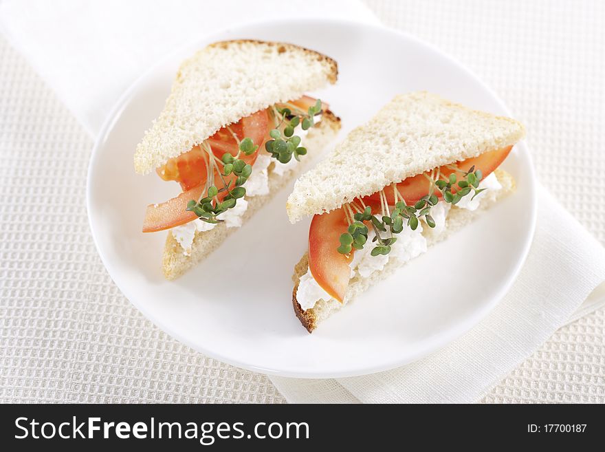 Vegetarian sandwiches with cottage cheese, tomatoes and mustard sprouts