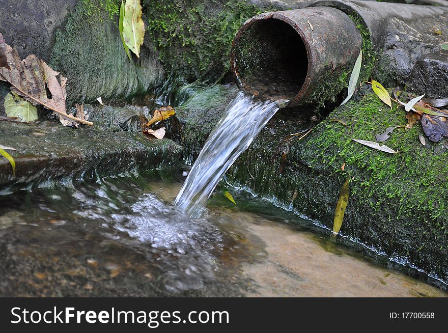 Spring water flowing from a pipe