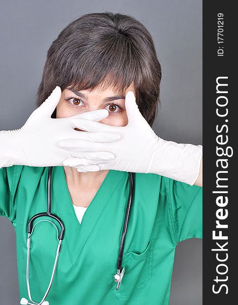 Doctor putting on white sterilized medical glove for making operation