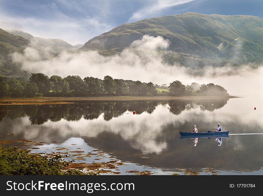 Low cloud drifts down the mountain to Loch Etive in Argyll and Bute, Scotland.