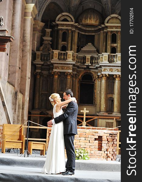 Bride and groom in front of church