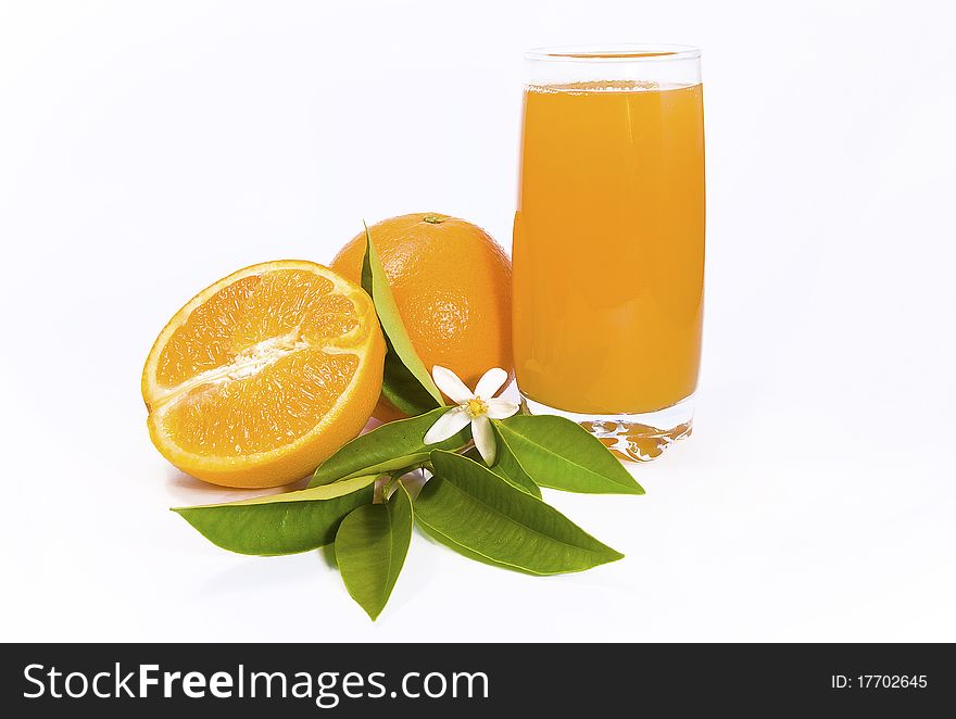 Orange anda a half with a glass of juice. Orange anda a half with a glass of juice