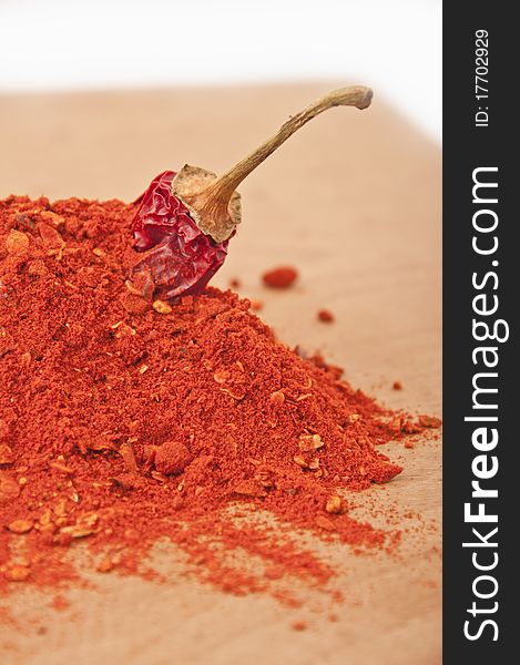 Ground red pepper in kitchen board. Ground red pepper in kitchen board