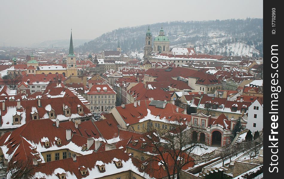 View down over the roof tops of Mala strana in Prague in winter as seen from Prague castle. View down over the roof tops of Mala strana in Prague in winter as seen from Prague castle