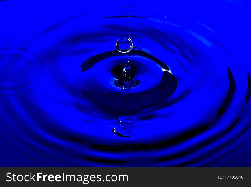 Beautiful Clear Water Drop on Blue Water. Beautiful Clear Water Drop on Blue Water