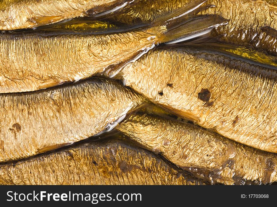 Background of the cooked sea sprats. Cooked fish. Background of the cooked sea sprats. Cooked fish