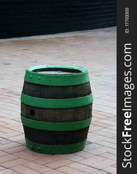 Green Wood Barrel Standing on the tiles