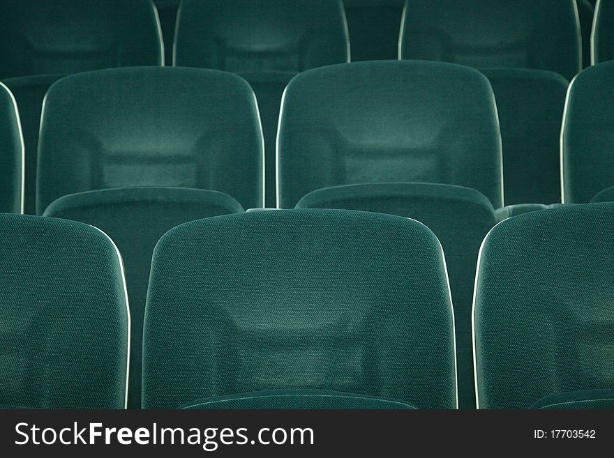 Empty green seats for cinema, theater, conference or concert