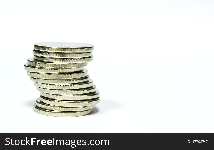 Isolated stacked coins on white background