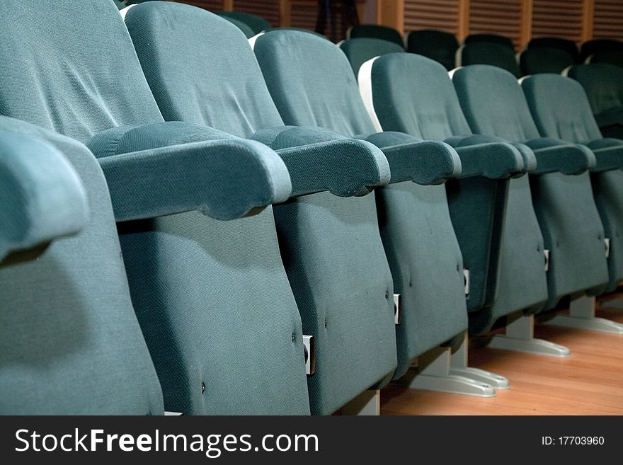 Empty green seats for cinema, theater, conference or concert