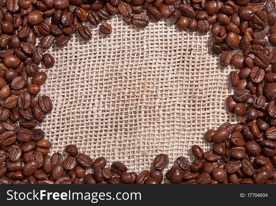 Coffee beans wiht brown canvas background