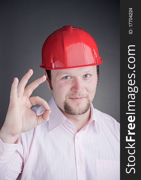 Young Engineer doing the ok sign and smiling at the camera