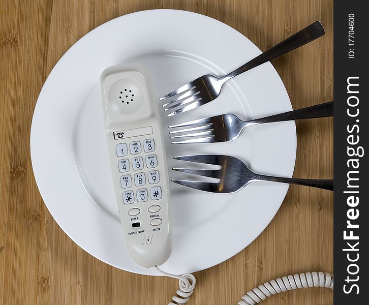 White Telephone on the plate. Telecommunications abstract
