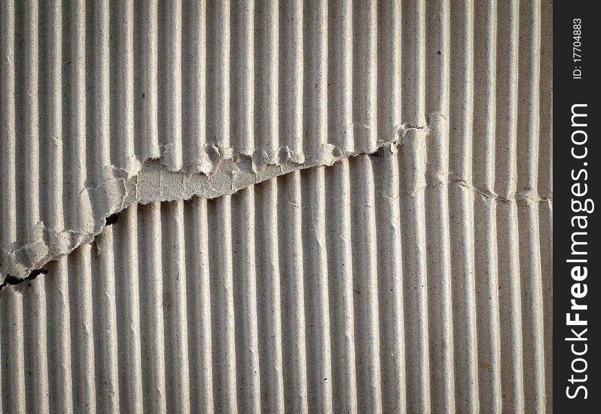 Texture of torn brown paper cardboard