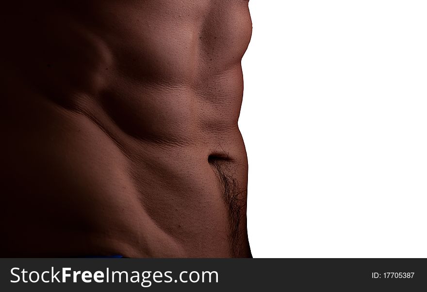Muscular male abdomen closeup with soft light isolated on white background
