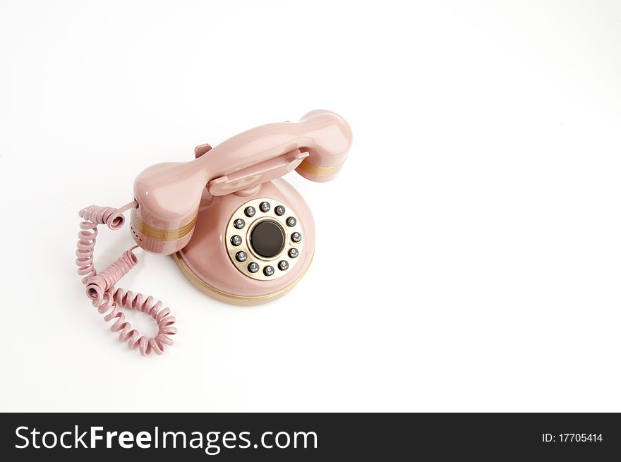 Antique pink phone isolated on white. Antique pink phone isolated on white