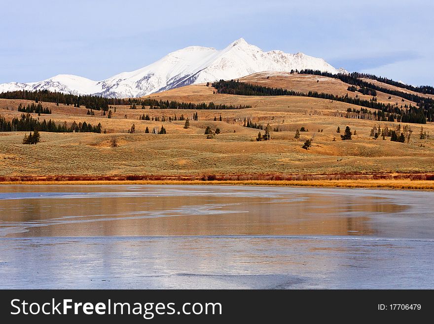 Snow Capped Mountain And Frozen Lake