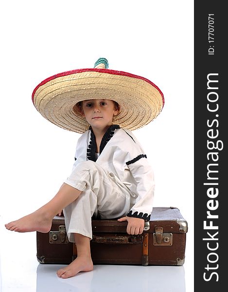 Toddler wearing a large sombrero hat. Toddler wearing a large sombrero hat