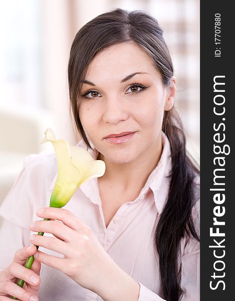 Young adult woman with flower at home. Young adult woman with flower at home