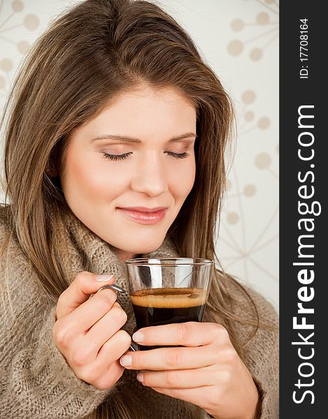 Young Girl Holding A Cup Of Coffee