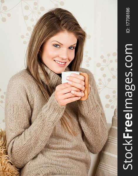 Beauty, young girl holding a cup and smiling