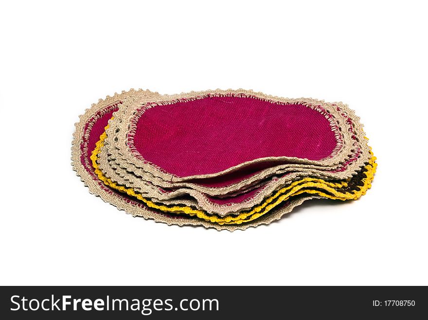 Colored knitted napkin on a white background. Colored knitted napkin on a white background