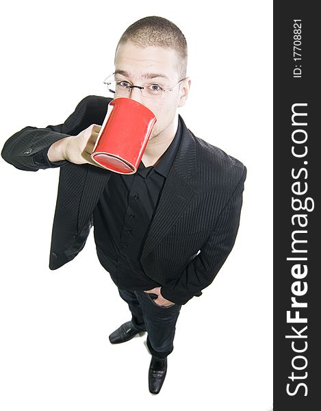 Businessman standing, holding a cup of coffee, fisheye, in suit, isolated on white background
