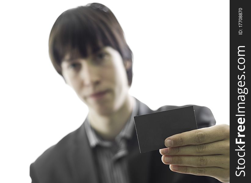 Young businessman holding a business card, small depth of focus, isolated