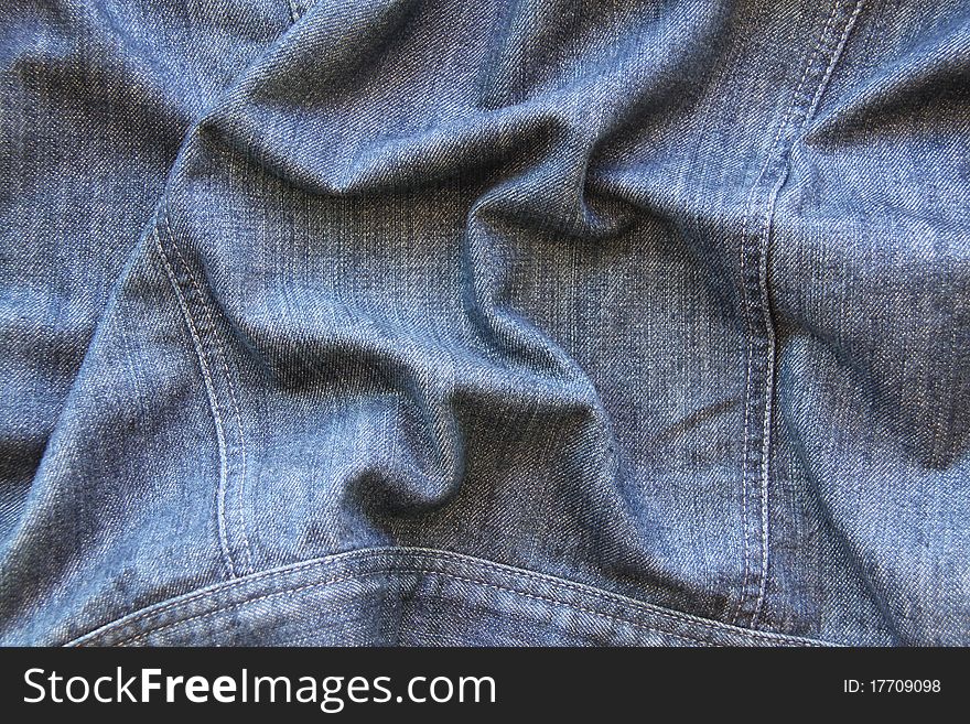 Close-up of the blue jeans cloth. Close-up of the blue jeans cloth