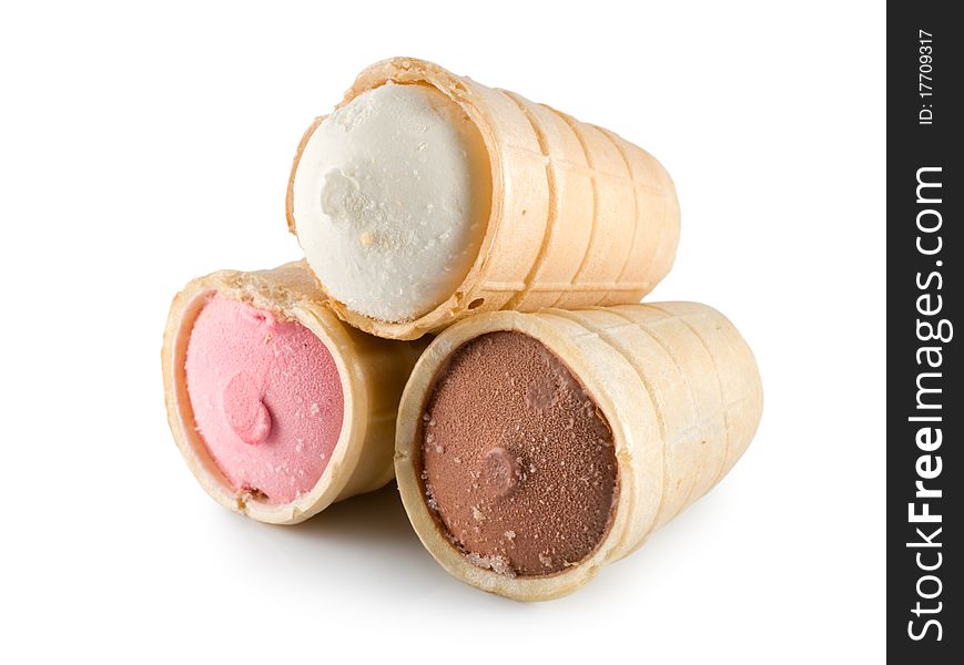 Three different flavors of ice cream cones... chocolate, vanilla, and strawberry. Three different flavors of ice cream cones... chocolate, vanilla, and strawberry