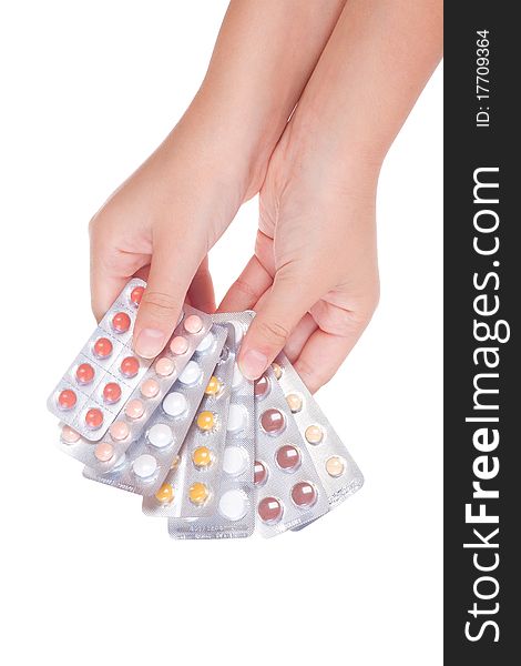 Medical pills containers on a female hand, isolated. Medical pills containers on a female hand, isolated