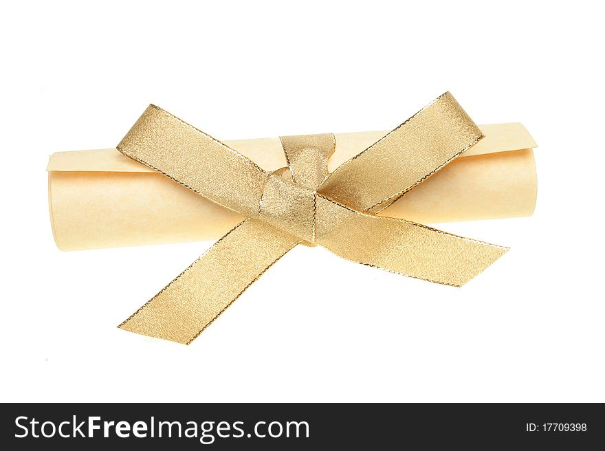 Rolled parchment scroll tied with a gold ribbon bow isolated against white. Rolled parchment scroll tied with a gold ribbon bow isolated against white