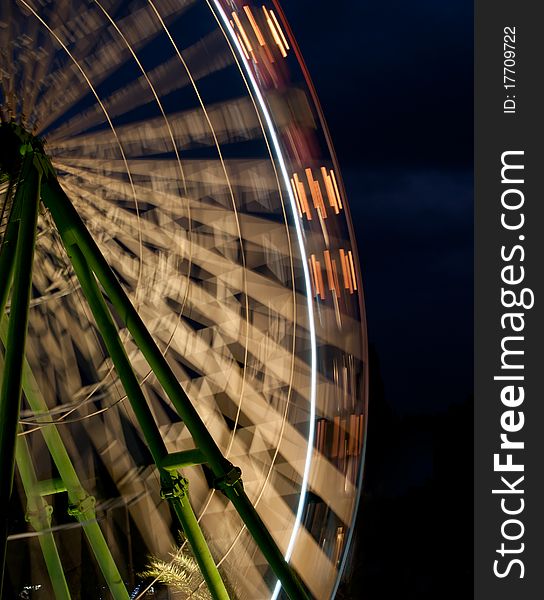 Ferris wheel turning around  in an amusement park