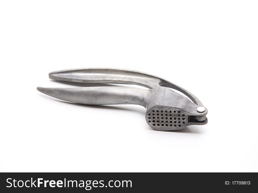 Old garlic press of metal