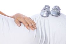 Happy Pregnant Girl Lies On White Background Royalty Free Stock Photos