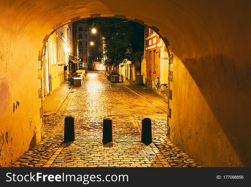 Riga, Latvia. Swedish Gate Gates Is A Famous Landmark. Cultural Monument In Lighting At Night Illumination