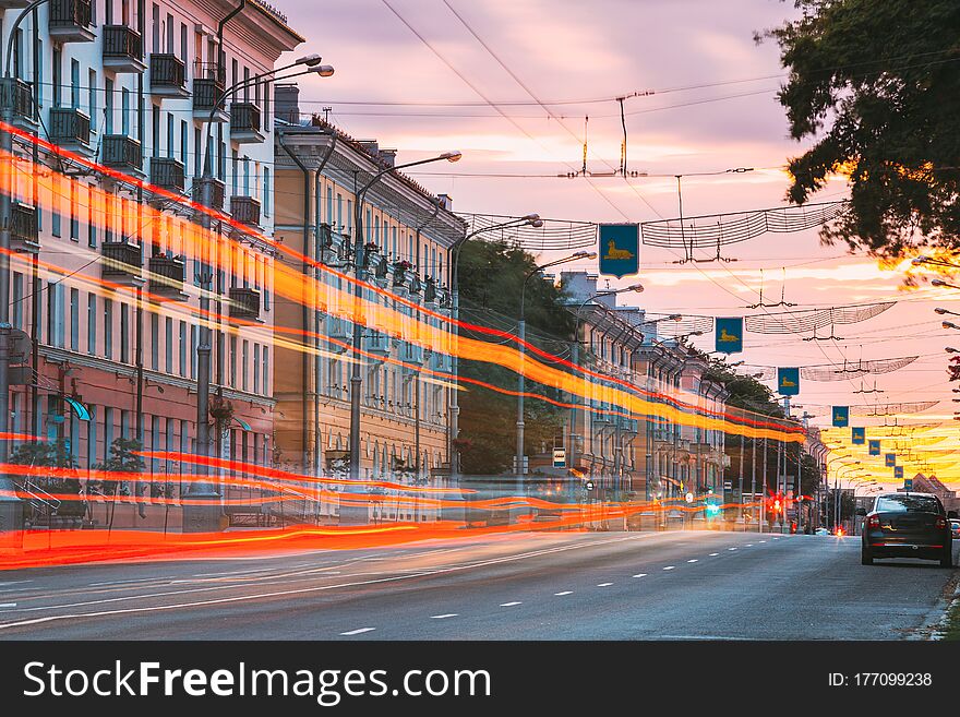 Gomel, Belarus. Traffic And Light Trails On Lenin Avenue In Eveining Or NIght. Street At Night At Long Exposure