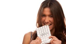 Pretty Angry Woman Bites Pack Of Tablets Pills Stock Photography